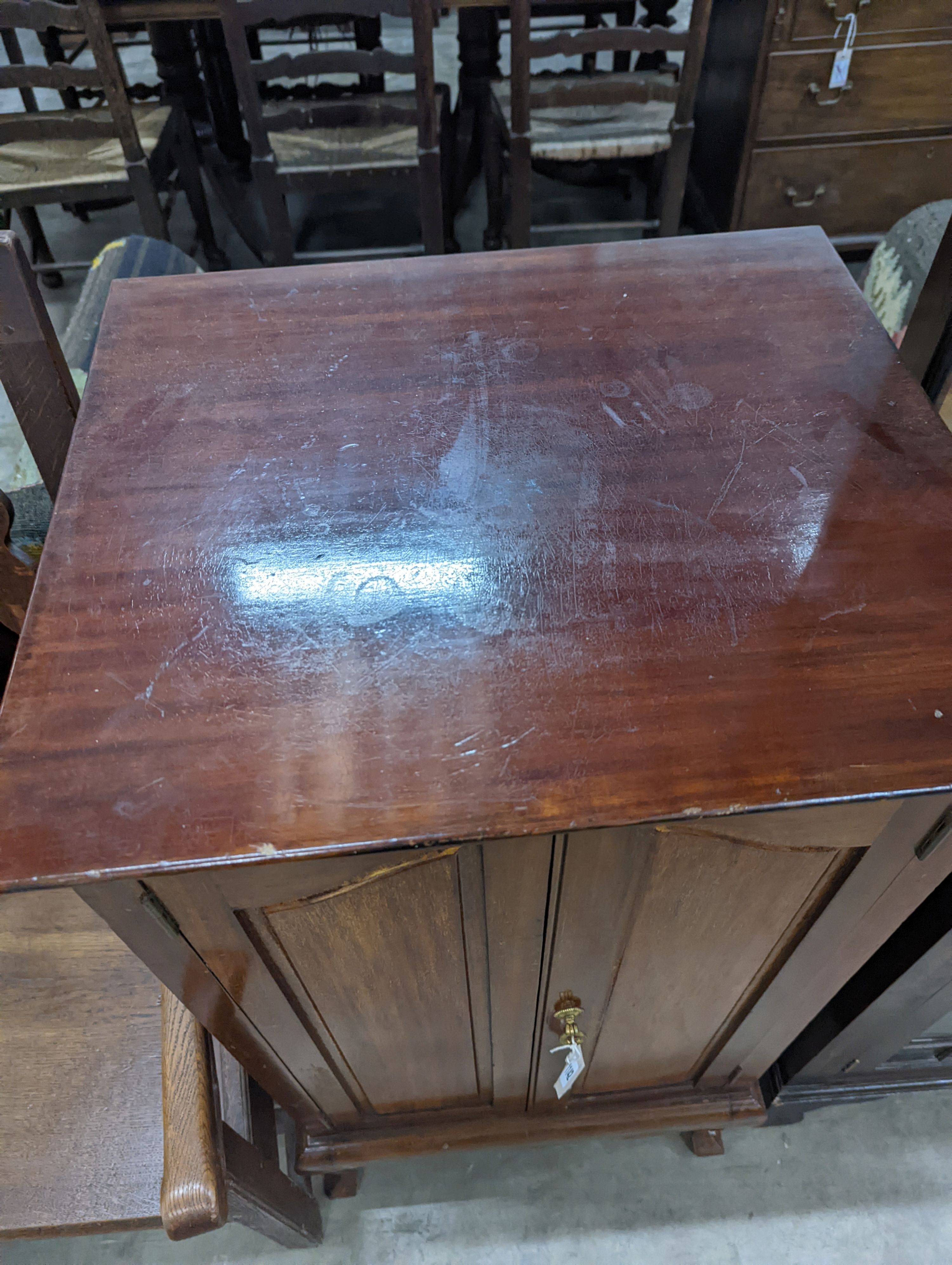 An Edwardian mahogany sheet music cabinet, width 52 cms, depth 46 cms, height 103 cms.